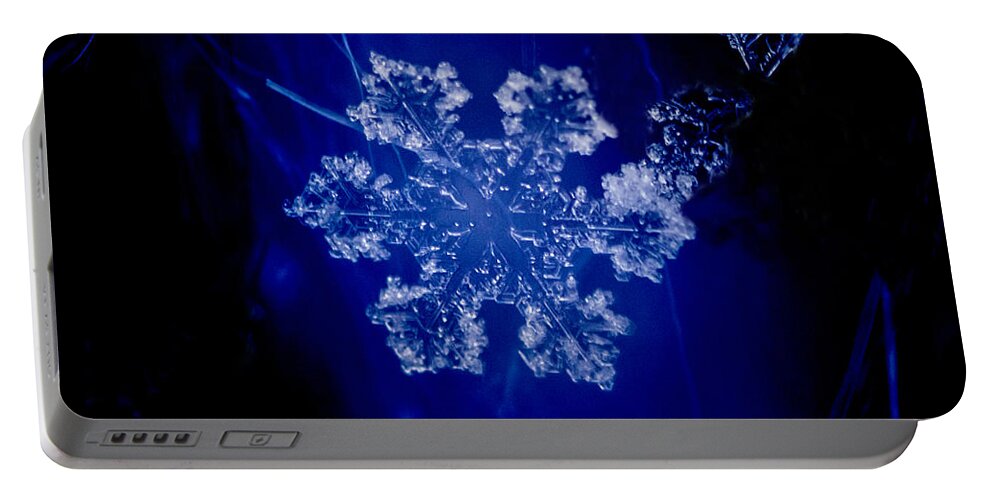 Colorado Portable Battery Charger featuring the photograph Snowflake on Blue by Dawn Key