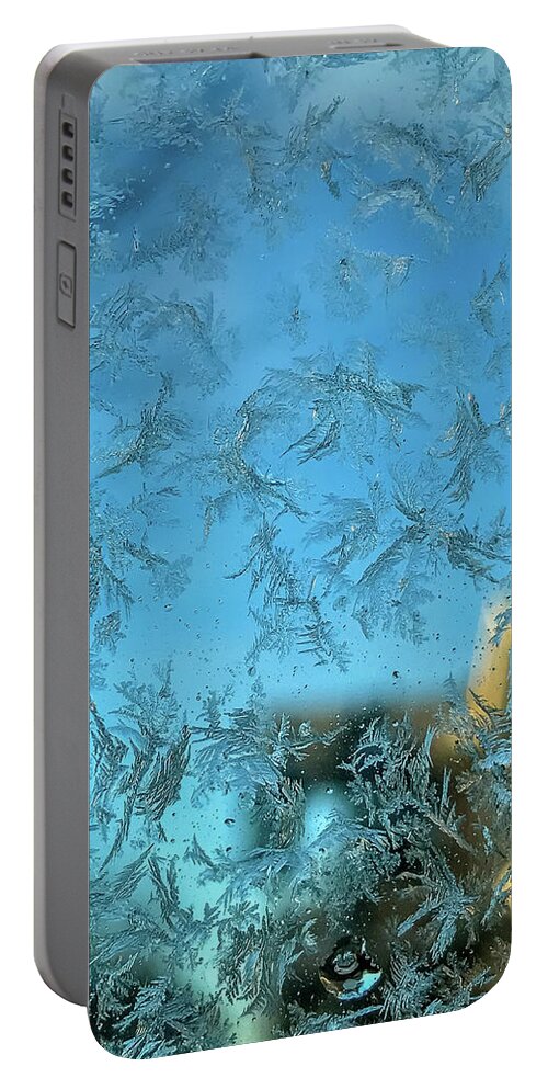 Backgrounds Portable Battery Charger featuring the photograph Snowflakes on glass by SAURAVphoto Online Store