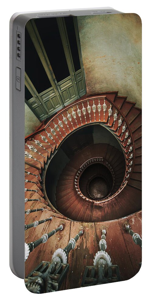 Spiral Portable Battery Charger featuring the photograph Spiral staircase in red and brown tones by Jaroslaw Blaminsky