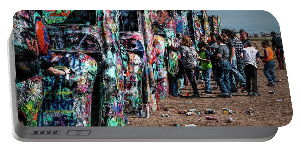 Landmark Portable Battery Charger featuring the photograph Spray Paint Fun at Cadillac Ranch by Randall Nyhof