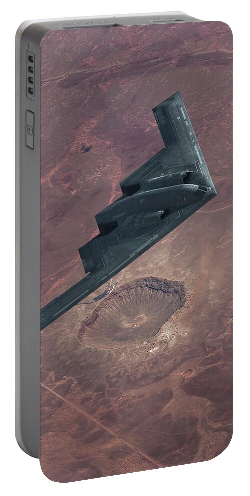 B-2 Stealth Bomber Portable Battery Charger featuring the mixed media Stealth over the Arizona Meteor Crater by Erik Simonsen