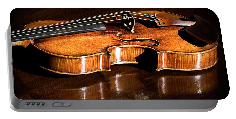 Strad Portable Battery Charger featuring the photograph Stradivarius in Sunlight by Endre Balogh