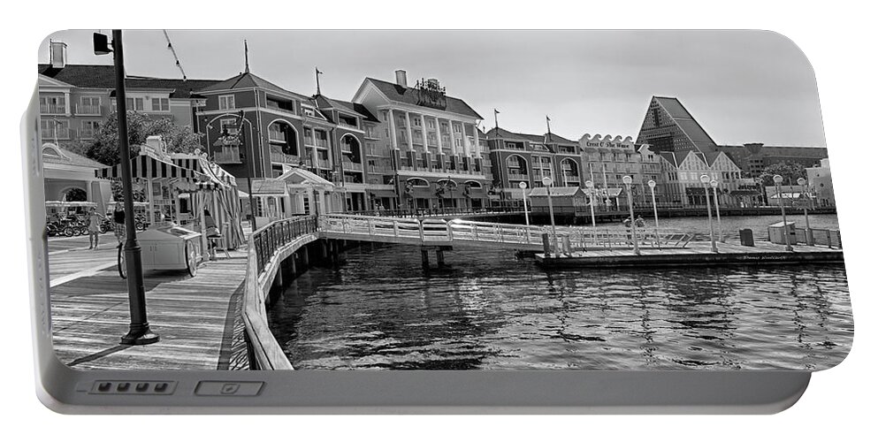 Black And White Portable Battery Charger featuring the photograph Strolling on the boardwalk in Black and White Walt Disney World MP by Thomas Woolworth