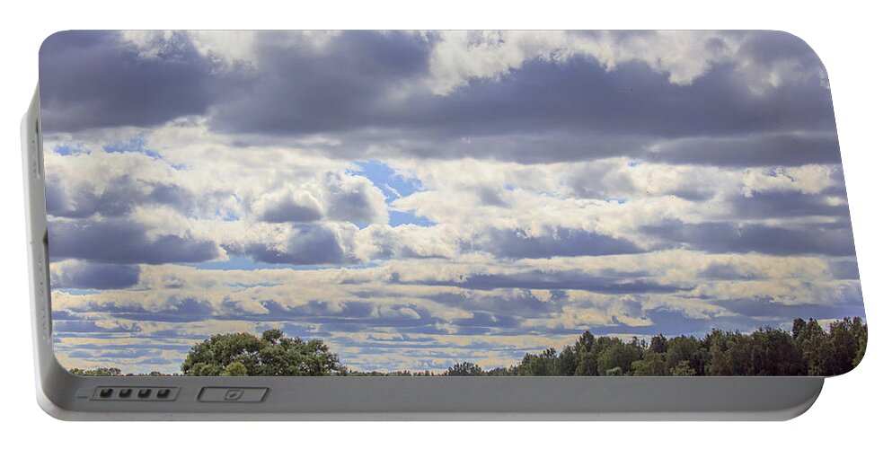 Cloud Portable Battery Charger featuring the photograph Summer clouds. by Leif Sohlman