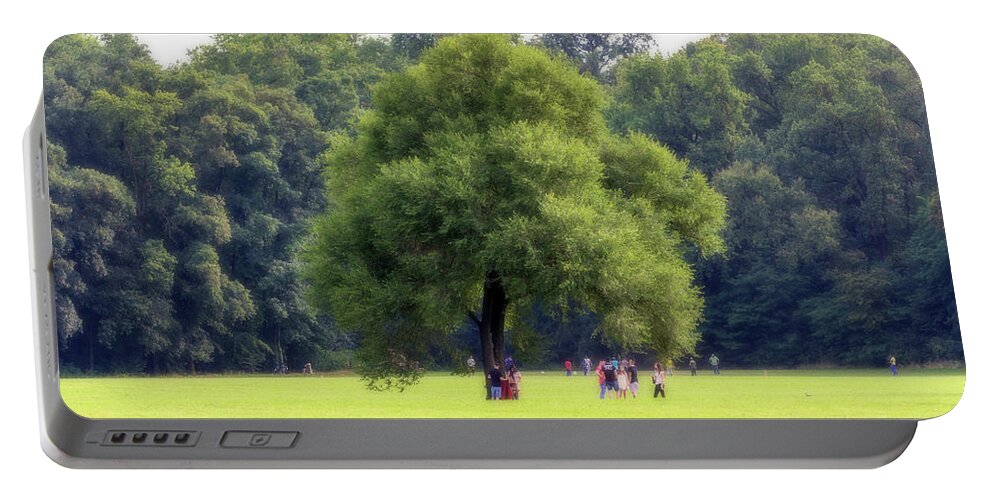 Countryscape Portable Battery Charger featuring the photograph Sunday at park by Roberto Pagani