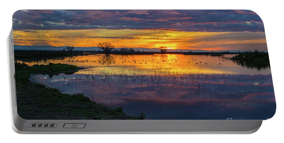 Sunrise Portable Battery Charger featuring the photograph Sunrise at the Merced National Wildlife Refuge by Mimi Ditchie
