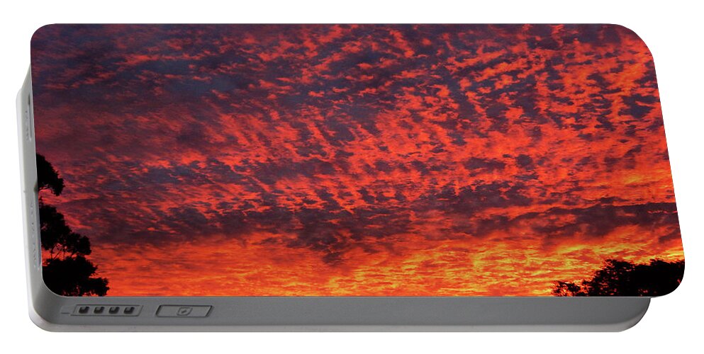 Sunrise Portable Battery Charger featuring the photograph Sunrise Eruption by Mark Blauhoefer