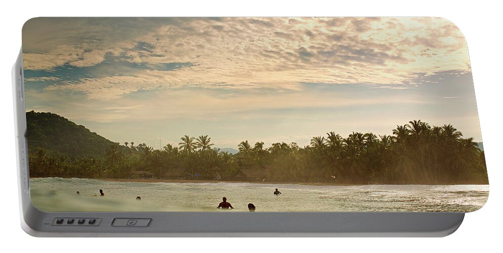 Surfing Portable Battery Charger featuring the photograph Sunrise Surfers by Nik West