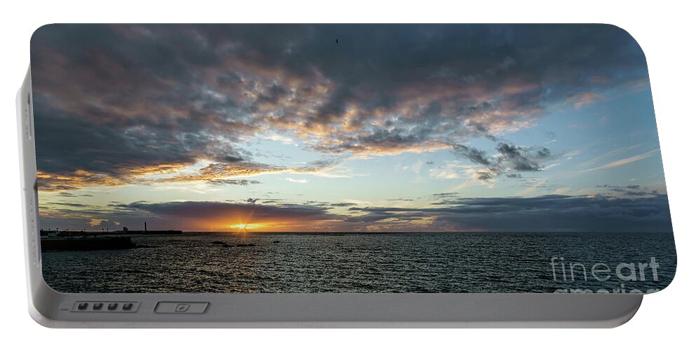 Sky Portable Battery Charger featuring the photograph Sunset Under a Stormy Sky by Pablo Avanzini