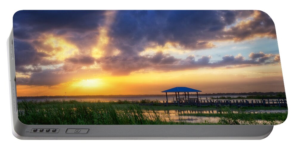 Boats Portable Battery Charger featuring the photograph The Boathouse at Sunset by Debra and Dave Vanderlaan