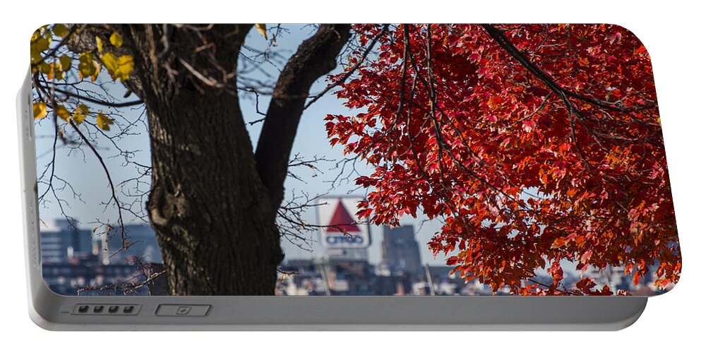 Boston Portable Battery Charger featuring the photograph The Citgo Sign Through the Trees Boston MA Charles River by Toby McGuire