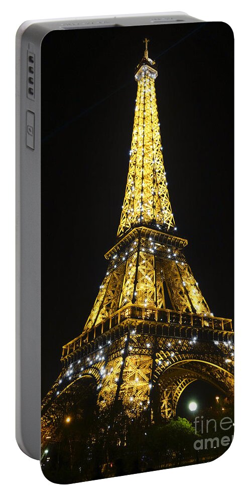 Eiffel Tower Portable Battery Charger featuring the photograph The Eiffel tower at night illuminated, Paris, France. by Perry Van Munster