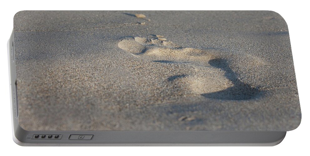 Outdoor Portable Battery Charger featuring the photograph The Footprint Of Invisible Man on The Sand by Yoel Koskas