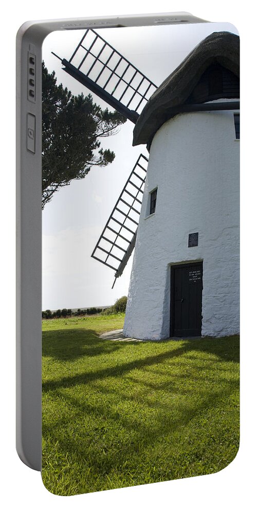 Historic Portable Battery Charger featuring the photograph The old Irish windmill by Ian Middleton