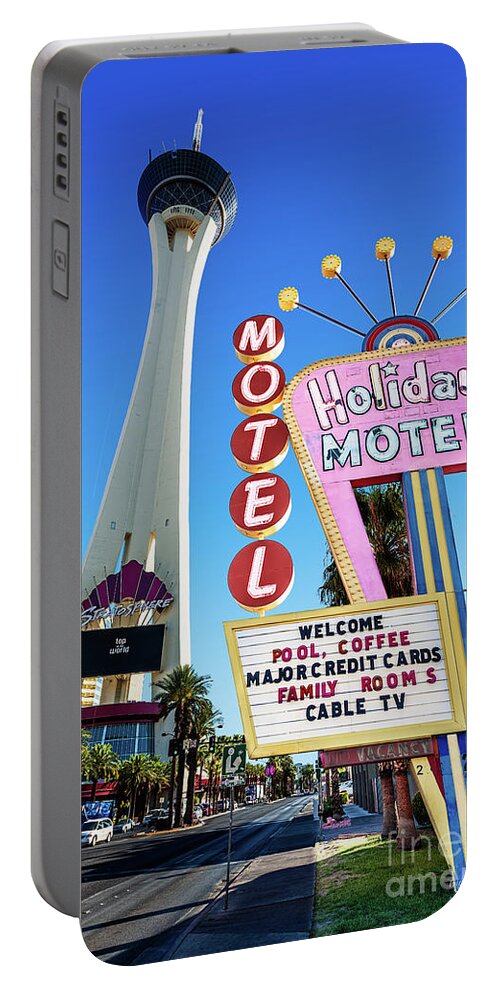The Stratosphere Portable Battery Charger featuring the photograph The Stratosphere Casino in Front of the Holiday Motel Sign by Aloha Art