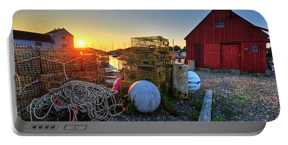 Rockport Portable Battery Charger featuring the photograph The sun rising by motif 1 in Rockport MA Bearskin neck lobster traps by Toby McGuire