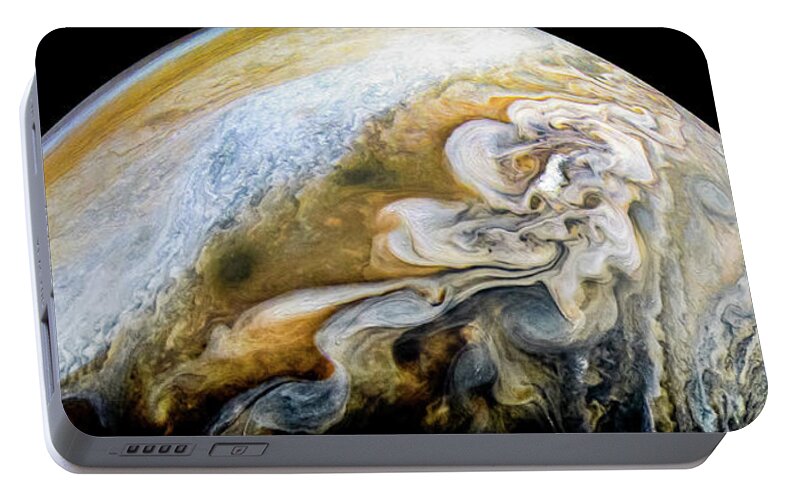 Juno Portable Battery Charger featuring the photograph The Swirling Cloud Formations of Jupiter by Eric Glaser
