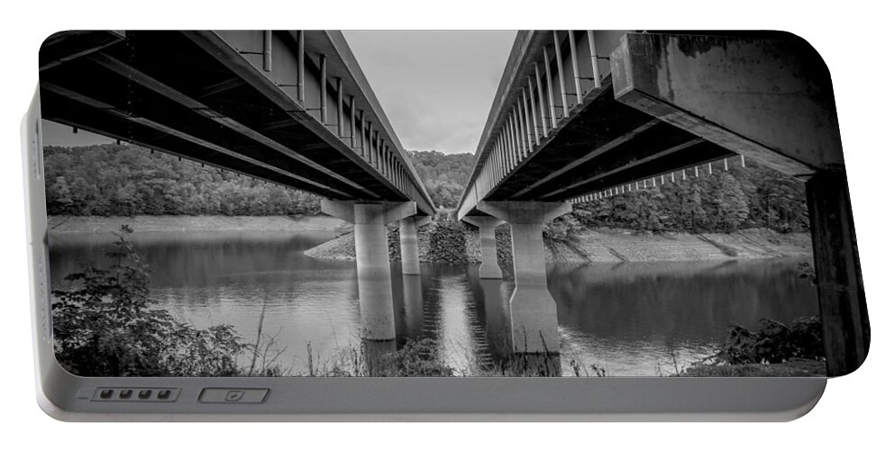 Kelly Hazel Portable Battery Charger featuring the photograph The Underside of Two Bridges Symmetry in Black and White by Kelly Hazel