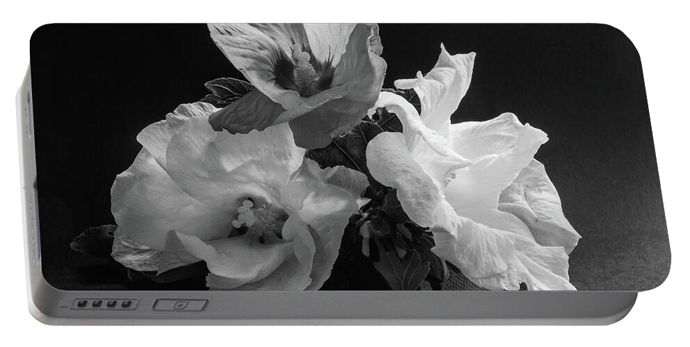 Flowers Portable Battery Charger featuring the photograph Three Hibiscus Monochrome by Jeff Townsend