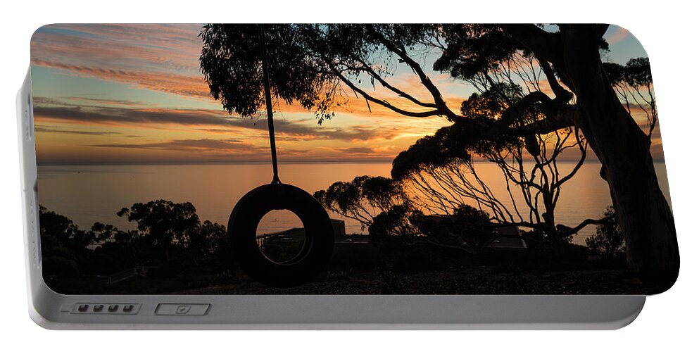 Sunset Portable Battery Charger featuring the photograph Tire Swing Sunset by Scott Cunningham