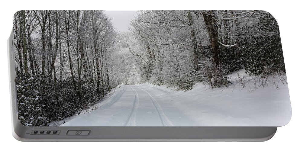 Snow Portable Battery Charger featuring the photograph Tire Tracks In Fresh Snow by D K Wall