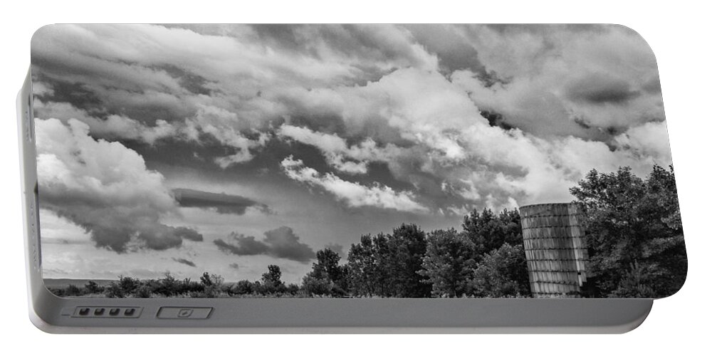 Barn Portable Battery Charger featuring the photograph Topless Silo Under the Clouds by Guy Whiteley