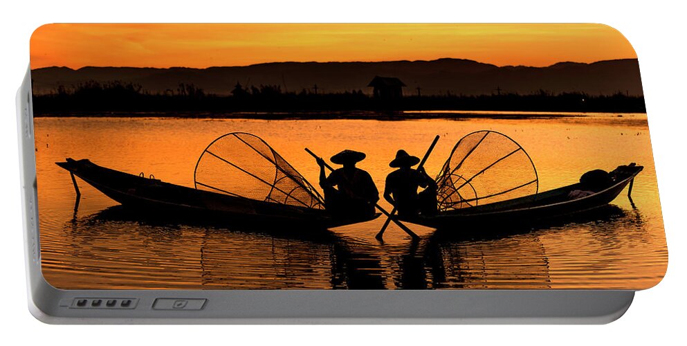 Travel Portable Battery Charger featuring the photograph Two fisherman at sunset by Pradeep Raja Prints