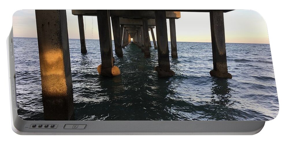 Ocean Portable Battery Charger featuring the photograph Under The Boardwalk by Val Oconnor