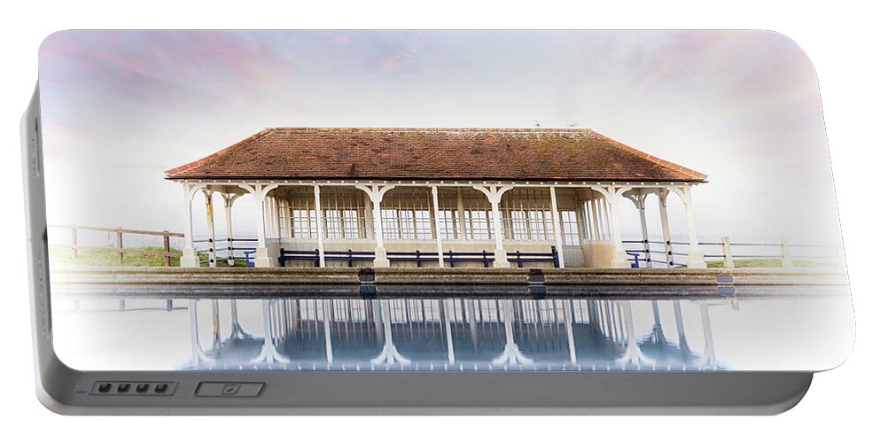 Sheringham Portable Battery Charger featuring the photograph Norfolk victorian seaside shelter with pink sunset sky by Simon Bratt