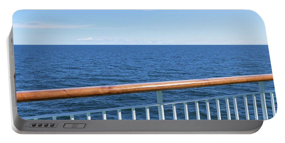Sea Portable Battery Charger featuring the photograph View at the sea from passenger ship by GoodMood Art