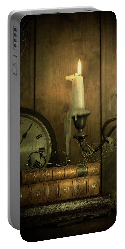 Vintage Portable Battery Charger featuring the photograph Vintage Books With Candles And An Old Clock by Ethiriel Photography