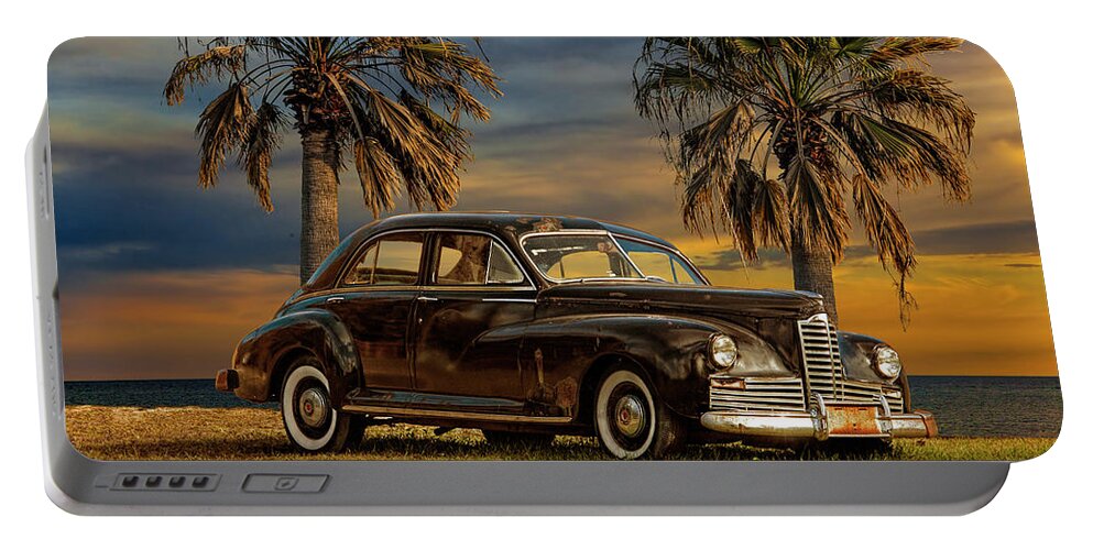 Auto Portable Battery Charger featuring the photograph Vintage Classic Automobile with Palm Trees at Sunrise by Randall Nyhof
