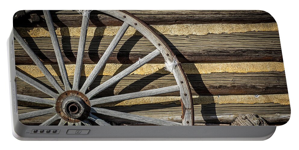 Wagon Portable Battery Charger featuring the photograph Wagon Wheel by Paul Freidlund