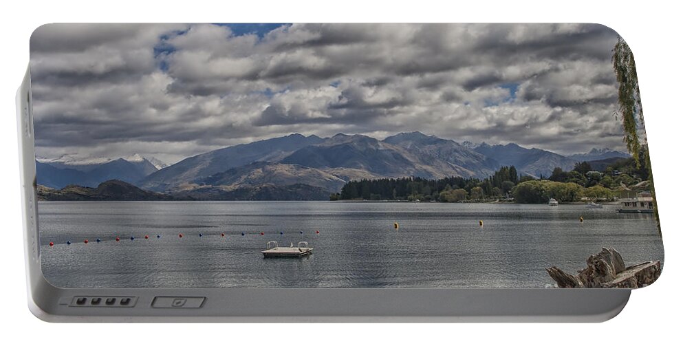 Background Portable Battery Charger featuring the photograph Wakatipu lake in New Zealand by Patricia Hofmeester