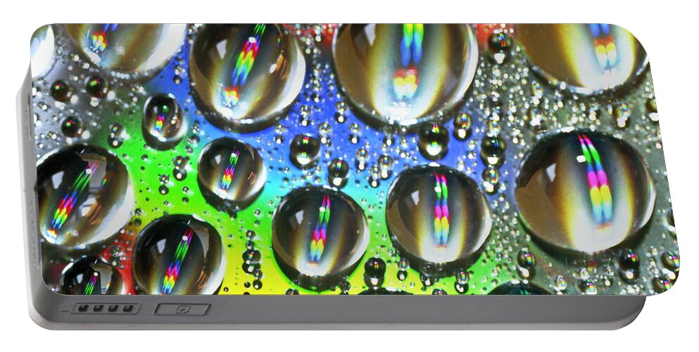 Heiko Portable Battery Charger featuring the photograph Water beads and spectrum colors by Heiko Koehrer-Wagner
