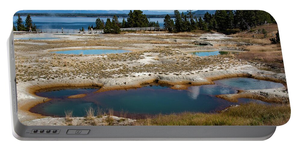 Geyser Portable Battery Charger featuring the photograph West Thumb Geyser Basin, Yellowstone by Aidan Moran
