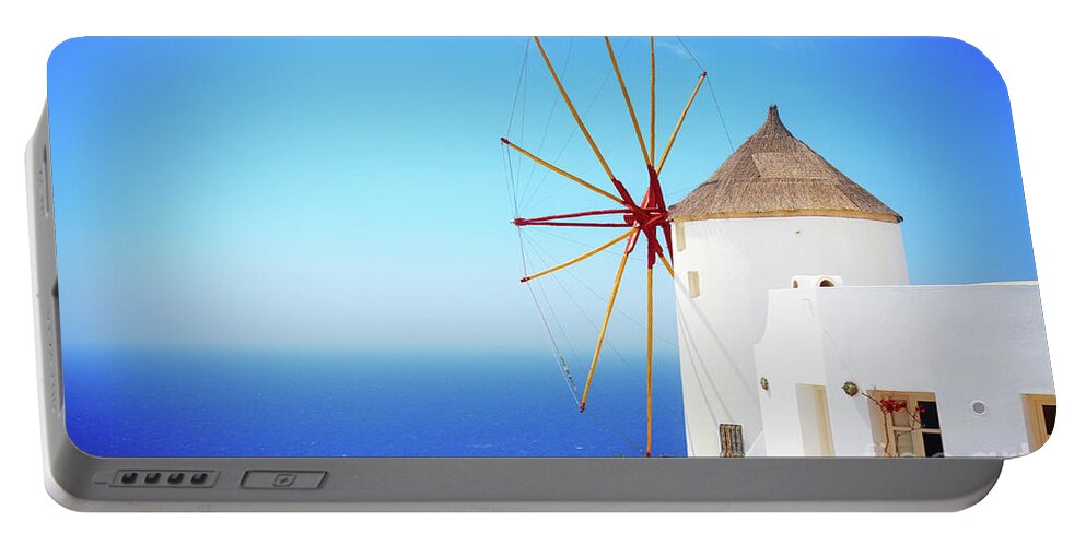Santorini Portable Battery Charger featuring the photograph Windmill of Oia and Aegan Sea by Anastasy Yarmolovich