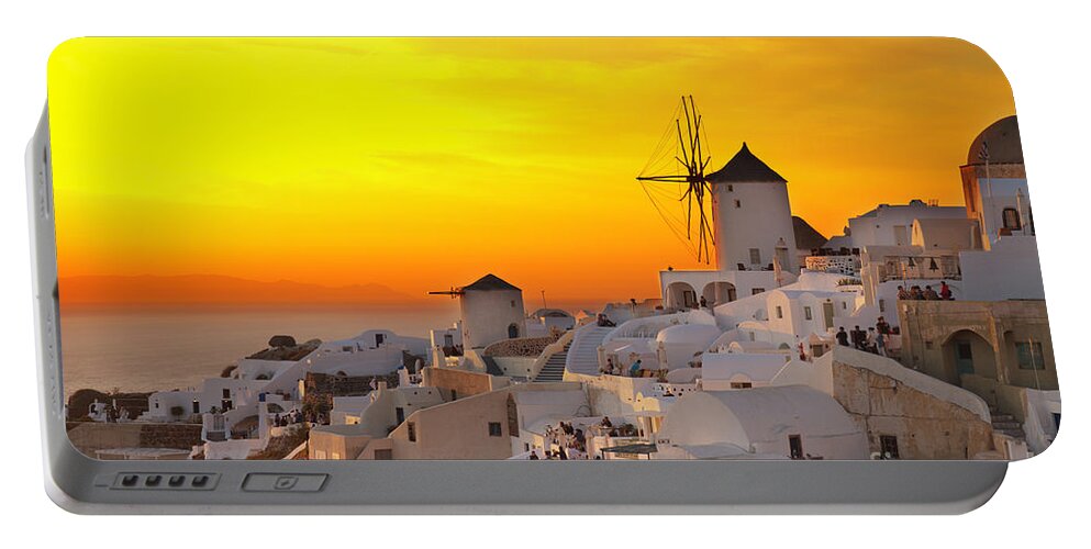 Santorini Portable Battery Charger featuring the photograph windmill of Oia at sunset, Santorini by Anastasy Yarmolovich