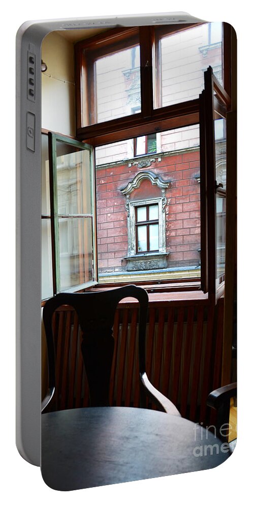 Krakow Portable Battery Charger featuring the photograph Window on the Street by Elaine Berger