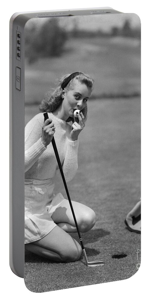 18th Portable Battery Charger featuring the photograph Woman Kissing Golf Ball, C.1950s by Debrocke/ClassicStock
