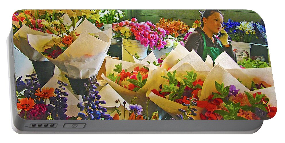 Woman Selling Flowers In Pike Street Market In Seattle Portable Battery Charger featuring the photograph Woman Selling Flowers in Pike Street Market in Seattle, Washington by Ruth Hager