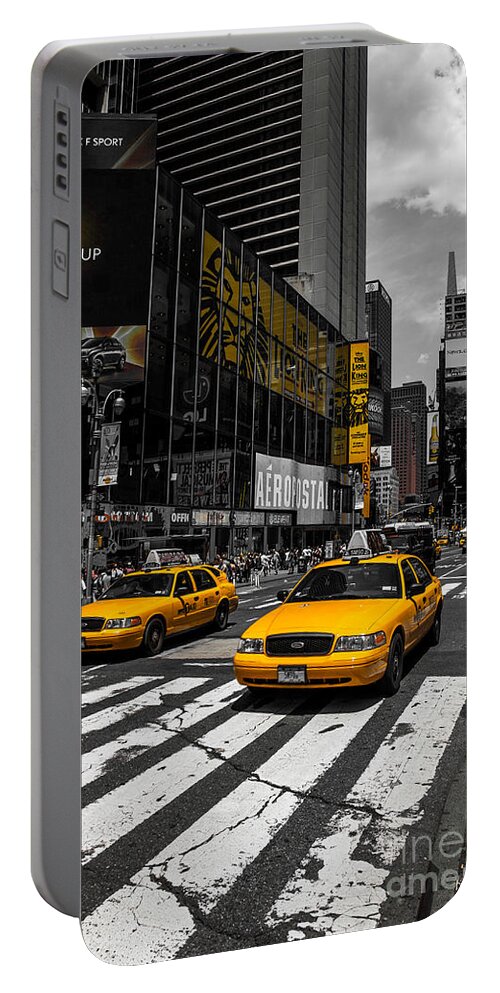 Manhattan Portable Battery Charger featuring the photograph Yellow Cabs cruisin on the Times Square by Hannes Cmarits