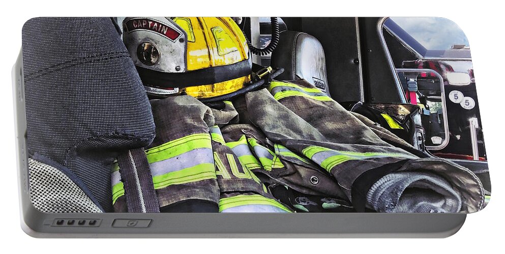 Fire Helmet Portable Battery Charger featuring the photograph Yellow Fire Helmet in Fire Truck by Susan Savad