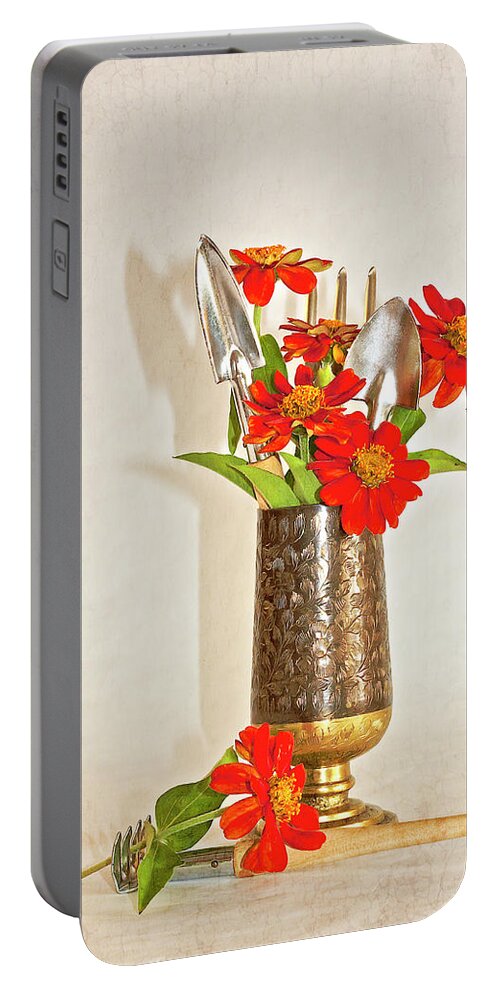 Zinnias Portable Battery Charger featuring the photograph Zinnias Among The Mini Garden Tools by Sandra Foster