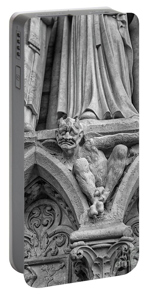 Notre Dame Portable Battery Charger featuring the photograph Sad gargoyle by Patricia Hofmeester