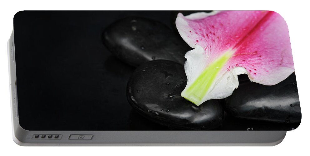 Spa Portable Battery Charger featuring the photograph Spa concept with lily petal by Jelena Jovanovic