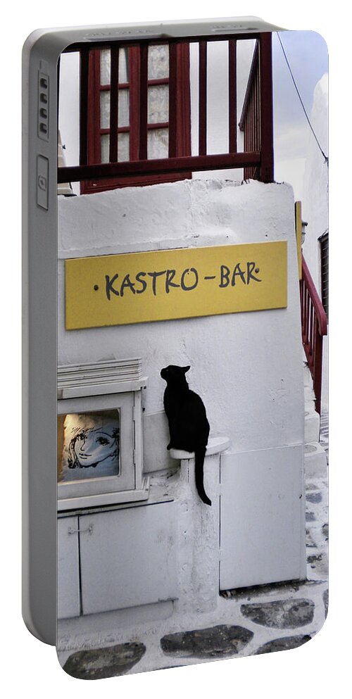 Cat Portable Battery Charger featuring the photograph A Curious Cat in Mykonos by Marilyn MacCrakin