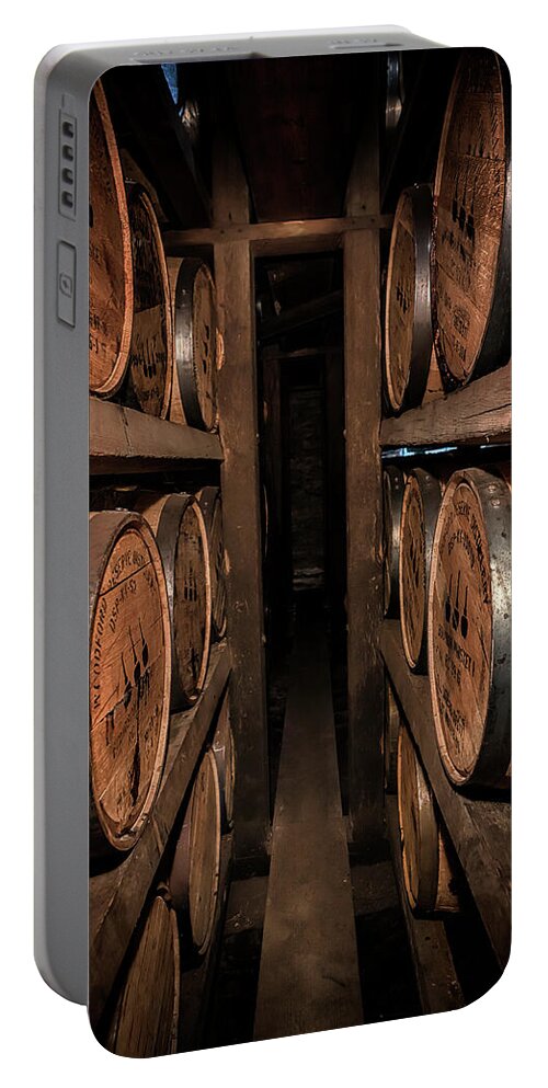Woodford Reserve Portable Battery Charger featuring the photograph A Peek Between the Ricks by Susan Rissi Tregoning