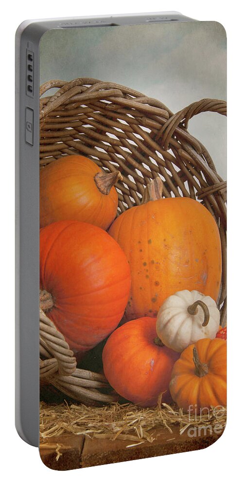 Pumpkin Portable Battery Charger featuring the photograph A Wicker Basket Full Of Pumpkins by Ethiriel Photography