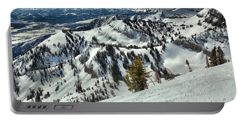 Rendezvous Bowl Portable Battery Charger featuring the photograph At The Jackson Hole Treeline by Adam Jewell